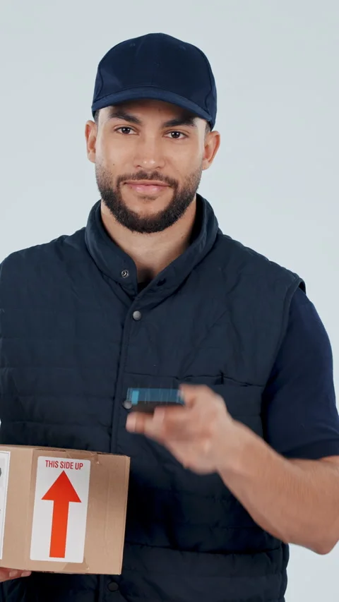 Face, box and delivery man with pos machine in studio for payment or checkout on 動画素材 336839962