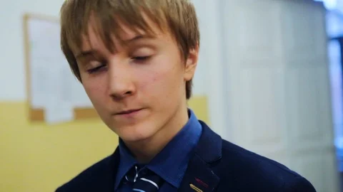 Face boy look at camera at school background in classroom break meal child Video stock 99255732