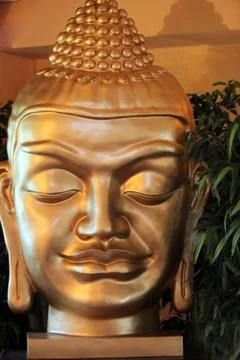 Face of a buddha statue Stock Photos