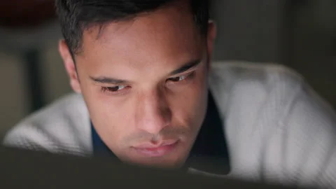 Face of businessman reading email on computer, planning coding strategy for Stock Footage 225262200