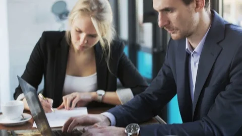 Face of a Businessman While he Types on a Laptop Stock Footage 71409146