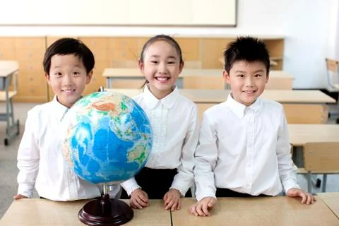 Face the camera. Globe Boy Chinese Knowledge Learning Luxx Asians Asian Class. Stock Photos