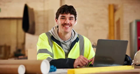 Face, carpenter and happy man in factory with laptop, project and pride for Stock Footage 338049448