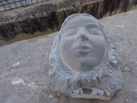 Face Carved in Stone Stock Photos