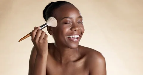 Face, cheek and blush with a model black woman in studio on a brown background Stock Footage 235395210