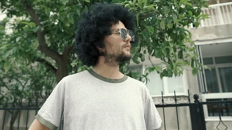 Face of cheerfull afro guy with curly black hair. 動画素材 109003716