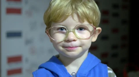 Face Of Child Boy In Old Glasses. Stockbeeldmateriaal 59757386