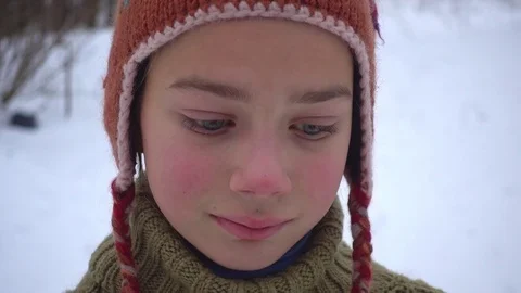 The face of the child is close-up smiling and sad looking at the camera. Stock Footage 84136207