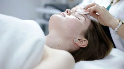Face cleaning with cotton balls Stock Footage 74356245