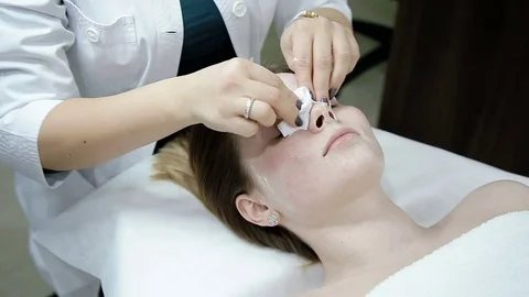 Face cleaning with cotton balls Stock Footage 74356851