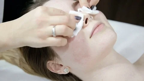 Face cleaning with cotton balls Stock Footage 74360090