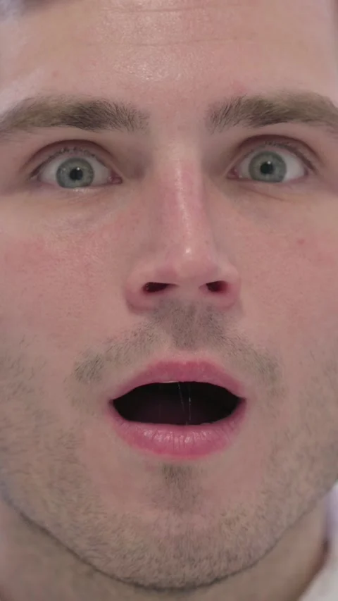 Face Close Up of Man with Shocked Expression, Vertical Video Stock Footage 337350853