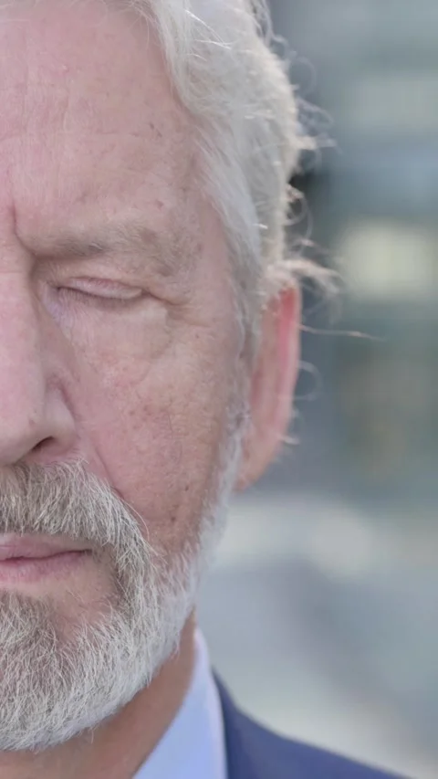 Face Close up of Old Businessman Looking at Camera, Vertical Video Video stock 339672148