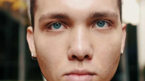Face Close Up of Serious Handsome Young Man outside urban city business office Stock Footage 143356022