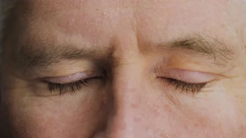 Face close up of tired elderly middle aged man closing his blue eyes. Stock Footage 144752063