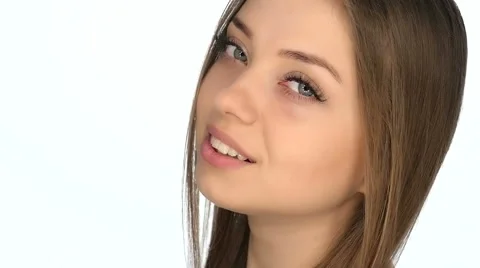Face closeup of the girl on a white background, slow motion 100fps Video stock 62649285