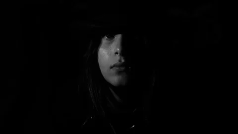 Face comes out of the shadow Stock Footage 79667673