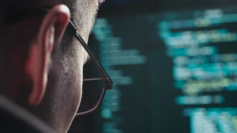 The face of a computer scientist close up Stock Footage