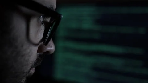 Face of Computer Scientist. Hacker or programmer. Low key light, closeup Stock Footage 192962039