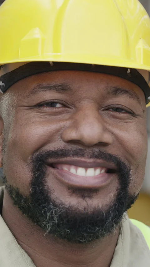Face, construction and smile with black man on site for building, inspection or Vídeos de archivo 327360681