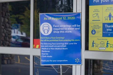 "Face coverings will be required to enter and shop this store" due to Covid-19 Stock Photos