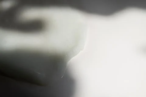 Face cream texture on white surface Stock Photos