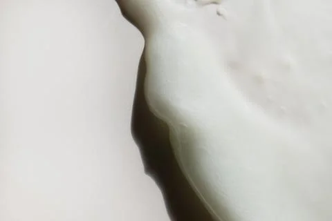 Face cream texture on white surface Stock Photos