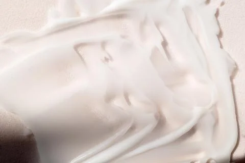 Face cream texture on white surface Foto stock