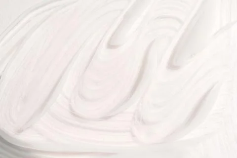 Face cream texture on white surface Foto stock
