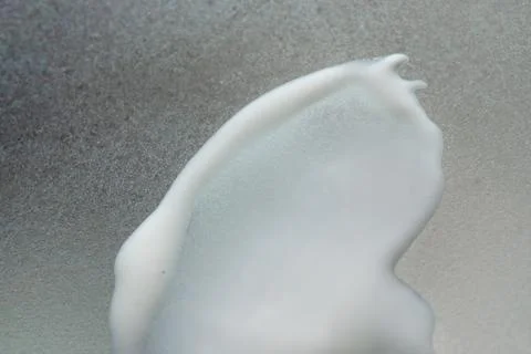 Face cream texture on white surface Stock Photos