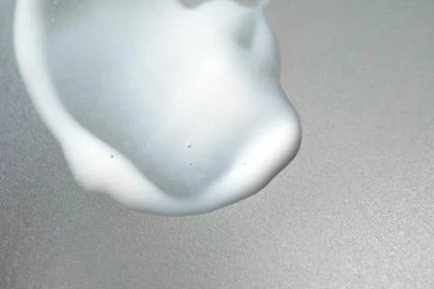 Face cream texture on white surface Stock Photos