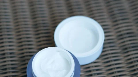 Face cream on the wicker table Stock Footage 121589139