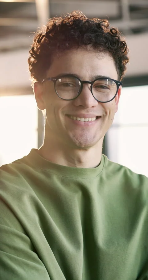 Face, creative and happy man with glasses in office for design, pride or Stock Footage 340601845