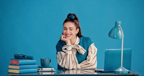 Face, creative writer and happy woman at desk in studio, copywriting and Stock Footage 329540117