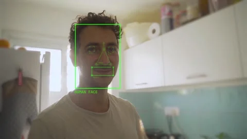 Face detection algorithm recognizing human face on a young man looking at camera Video stock 284354005