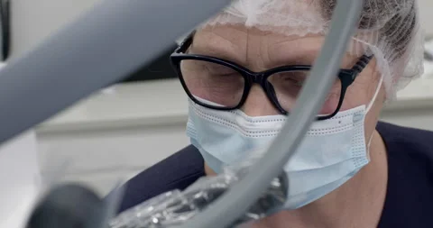 The face of a doctor in glasses and a protective mask Stockbeeldmateriaal 246691153