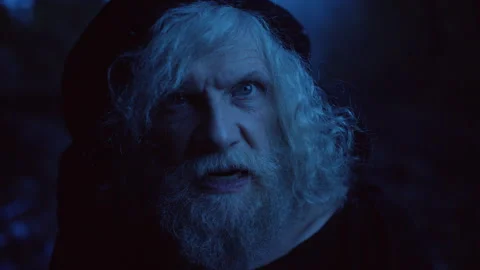 Face of an Elderly man performing witchcraft in the forest Stock Footage 283215749