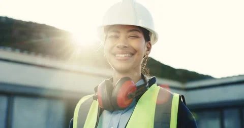 Face, engineer and woman at construction site with smile, pride and optimistic Video stock 345643493