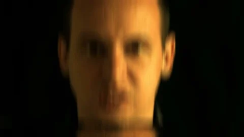 The face of evil men distorted random characters. Concept: a glitch in the Stock Footage 76566589