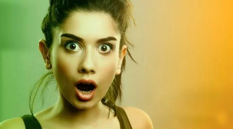 Face expression of shocked surprised young woman Stock Photos