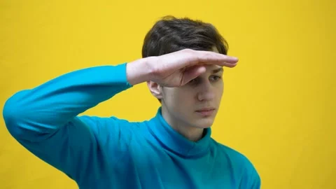 Face expressions. Boy in blue clothes making seeking gesture with his hand on Stock Footage 233725134