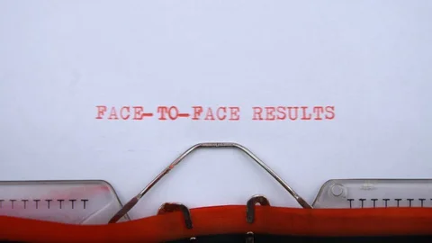 Face-To-Face results  - phrase printed on an old typewriter in red letters Video stock 128400634