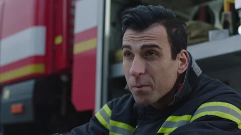 Face of a firefighter in front of the truck Stock Footage 283140518