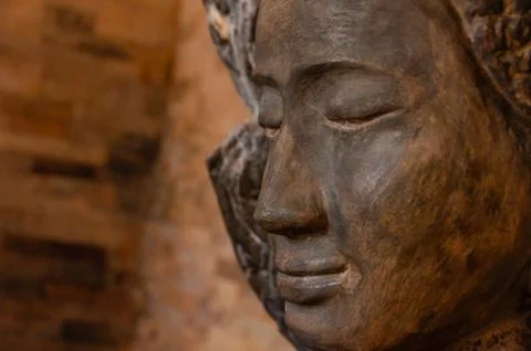 Face front of stone Buddha Stock Photos