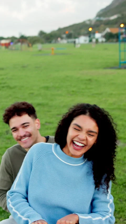 Face, fun and laughing with couple on seesaw in park for holiday, vacation or Stock Footage 339155352