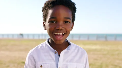 Face, funny and boy in park, kid and summer holiday to relax, travel weekend and Stock Footage 331337646
