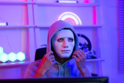 This is the face of a hacker who is knowledgeable with operating systems a... Stock Photos