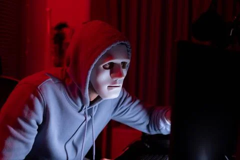 This is the face of a hacker who is knowledgeable with operating systems a... Stock Photos