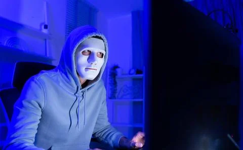 This is the face of a hacker who is knowledgeable with operating systems a... Stock Photos