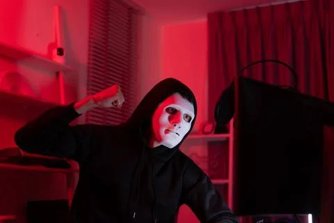 This is the face of a hacker who is knowledgeable with operating systems a... Stock Photos